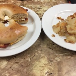 Bacon egg and cheese bagel and home fries.