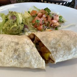 Veggie burrito with no cheese or sour cream making it a vegan meal