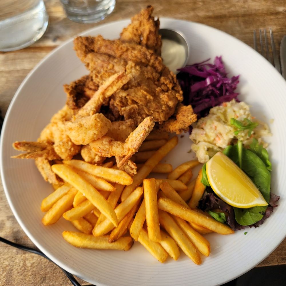 My lunch, Montauk Whiting fish w/ Jumbo Shrimp along with fries and slaw. My lunch, Montauk Whiting fish w/ Jumbo Shrimp along with fries and slaw.