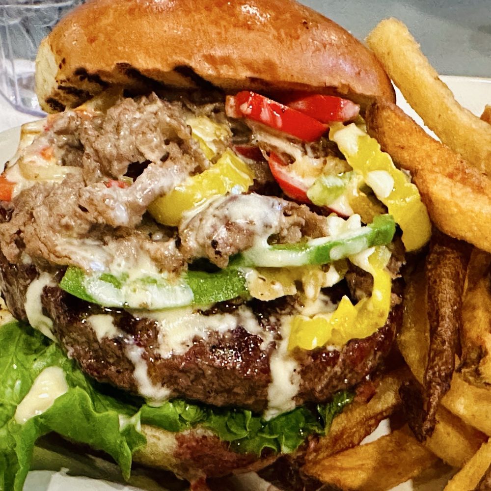 Oscar’s Alehouse - Philly cheesesteak burger special - Bars Near Me - Woodstock, Maryland Oscar’s Alehouse - Philly cheesesteak burger special - Bars Near Me - Woodstock, Maryland