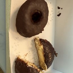 Chocolate ring and vegan Boston cream doughnuts. Chocolate ring and vegan Boston cream doughnuts.
