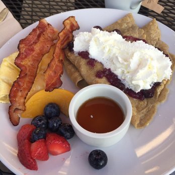 The Farmhouse Inn & Kitchen - Crepe with bacon and egg outdoor seating. - Bed & Breakfast Near Me - Whitefish, Montana