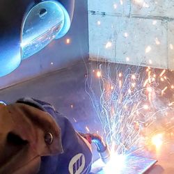 Metal Shop Fantasy Camp - Practicing mig welding.