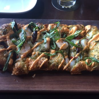 JOEY Bellevue - Shrimp and pesto flatbread. Has a little sriracha aioli on the top. This is my go to appetizer. - New American Near Me - Bellevue, Washington