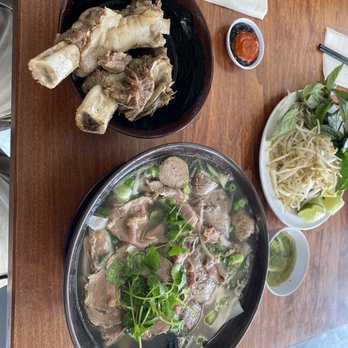 Pho Bistro - Pho Dac Biet #1 comes with the 2 beef ribs, Small bowl of broth oil and green onion. Try it, it's free. - Vietnamese Near Me - Elk Grove, California Pho Bistro - Pho Dac Biet #1 comes with the 2 beef ribs, Small bowl of broth oil and green onion. Try it, it's free. - Vietnamese Near Me - Elk Grove, California