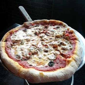 Tony C's - Sausage and black olives! Delish, but based on the shape, I think the guy or gal who throws the pizzas was drunk that day. - Pizza Near Me - Bee Cave, Texas Tony C's - Sausage and black olives! Delish, but based on the shape, I think the guy or gal who throws the pizzas was drunk that day. - Pizza Near Me - Bee Cave, Texas