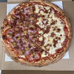 Porky's Pizza - half all meat, half pineapple and bacon pizza.
