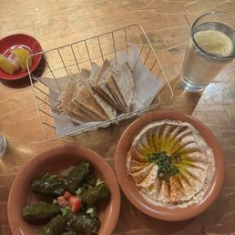Grape leave & hummus appetizer!!!!! Perfect amount for 2 people. Im Lebanese and these may beat my Sittos grape leaves!! So amazing 10/10
