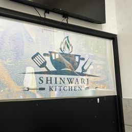 a sign for shinwar kitchen a sign for shinwar kitchen