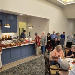 Twin Rivers Senior Living - Residents socializing at special event