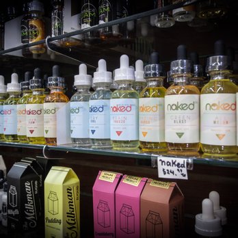 E-Smoke & Beer - a shelf of alcohol bottles - Vape Shops Near Me - New York, New York E-Smoke & Beer - a shelf of alcohol bottles - Vape Shops Near Me - New York, New York