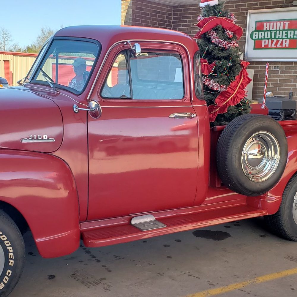 Misty's Conoco & Convenience Store - a red truck with a wreath on the back - Convenience Stores Near Me - Leslie, Arkansas Misty's Conoco & Convenience Store - a red truck with a wreath on the back - Convenience Stores Near Me - Leslie, Arkansas