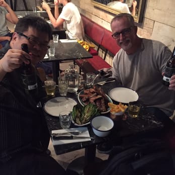 Blacklock - Me and a work mate showing off a plate of the skinny pork, stake and lamp chops. - British Near Me - London, XGL