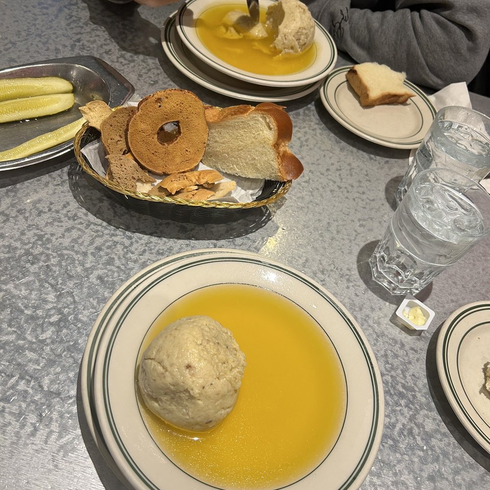 The Bagel Restaurant and Deli - Golden Chicken Broth with Matzo Ball - Delis Near Me - Chicago, Illinois The Bagel Restaurant and Deli - Golden Chicken Broth with Matzo Ball - Delis Near Me - Chicago, Illinois