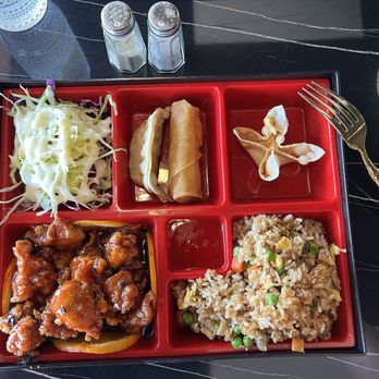 Stellar 66 - Orange chicken bento box meal with house fried rice, spring roll, salad crab Rangoon and a potsticker!! - Chinese Near Me - Gilbert, Arizona