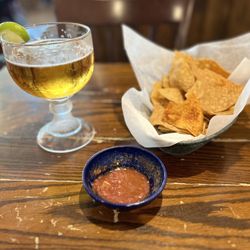 El Paseo Mexican Restaurant - Fort Worth - The table was a little beat up , but the chips and salsa was good .