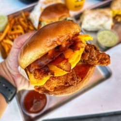 Egg N Bird - Signature Egg N Bird Sandwich! Choice of Grilled or Fried Chicken, Egg, Bacon, Cheese, Spicy Honey and Crack Sauce on a Toasted Brioche Bun