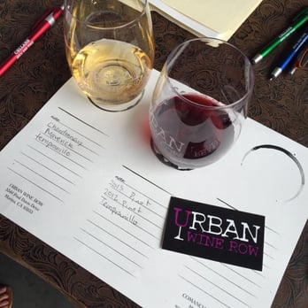 Urban Wine Row - a glass of wine and a menu - Wine Tasting Room Near Me - Marina, California Urban Wine Row - a glass of wine and a menu - Wine Tasting Room Near Me - Marina, California