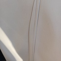 Total Laundry Services - Seam of pants in middle. Notice each side.