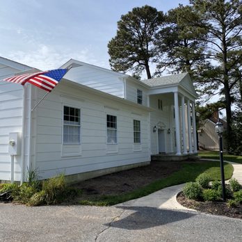 Solid Construction - a white house with an american flag on the front porch - General Contractors Near Me - Lewes, Delaware
