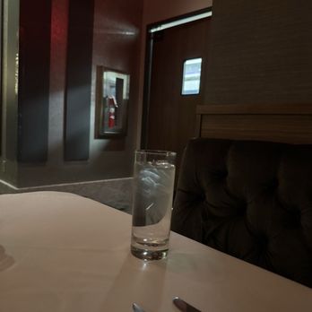 Ruth's Chris Steak House - Our reservation table with view of the kitchen door. Pretty dark where we sat - Steakhouses Near Me - Reno, Nevada Ruth's Chris Steak House - Our reservation table with view of the kitchen door. Pretty dark where we sat - Steakhouses Near Me - Reno, Nevada