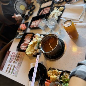 Orion Hot Pot - All our food!  The brisket, chicken and lamb meat options The passion green tea drink - Hot Pot Near Me - Arvada, Colorado