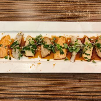 Hachi - a long rectangular plate of food on a wooden table - Sushi Bars Near Me - Chalfont, Pennsylvania