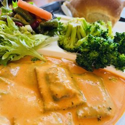 Il Pastaio - Asparagus ravioli is tomato cream sauce, brocolli with chilli, salad and bread