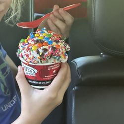 Cup of ice cream with sprinkles and m&m's