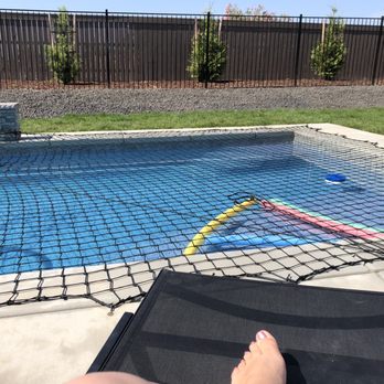 Pool Man - a woman's bare feet in a pool - General Contractors Near Me Pool Man - a woman's bare feet in a pool - General Contractors Near Me