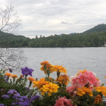 Eres Pizza - a view of a lake with flowers in the foreground - Pizza Near Me - Lake Placid, New York