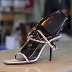 Houston Quality Shoe Repair - Pair of high heels with new glossy sole protectors.