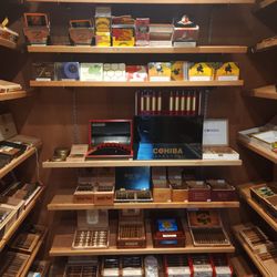 Turning Leaf Madison East showing walk in humidor with cigars and cigarillos