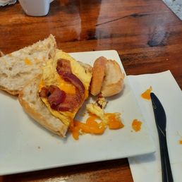 Disgusting cheese curds on top of defrosted "ciabatta" roll with overcooked (micro'd) egg.  UGH !!