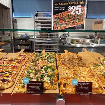 Loblaws - a variety of pizzas in a display case - Grocery Near Me - Toronto, Ontario Loblaws - a variety of pizzas in a display case - Grocery Near Me - Toronto, Ontario