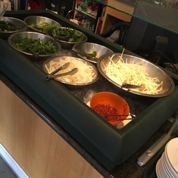 Time 4 Pho - a man preparing food in a restaurant - Vietnamese Near Me - Seattle, Washington Time 4 Pho - a man preparing food in a restaurant - Vietnamese Near Me - Seattle, Washington
