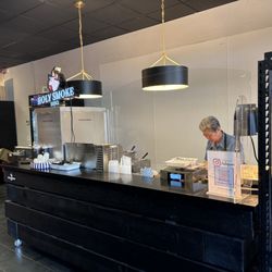 Holy Smoke BBQ - Jane working behind BBQ counter