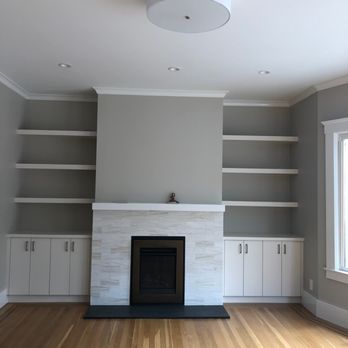 Hawke Construction - a living room with a fireplace and built in shelvings - General Contractors Near Me - San Francisco, California Hawke Construction - a living room with a fireplace and built in shelvings - General Contractors Near Me - San Francisco, California