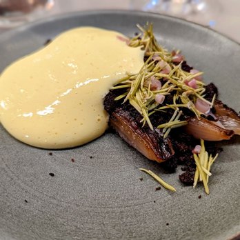 Fradei Bistro - October 13, 2022; Caramelized shallots with pumpernickel, ramp, and spruce. - Wine Bars Near Me - Brooklyn, New York Fradei Bistro - October 13, 2022; Caramelized shallots with pumpernickel, ramp, and spruce. - Wine Bars Near Me - Brooklyn, New York