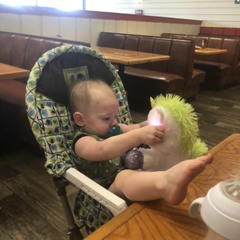 Darrell's Dog Gone Good Diner - Gand baby girl eating lunch ( actually she's eating her unicorn) at Darrell's - Breakfast & Brunch Near Me - Ocala, Florida