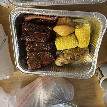 Famous Dave's Bar-B-Que - Full rack of ribs with corn on the cob, fully loaded baked potato and corn muffin - Barbeque Near Me - Reno, Nevada