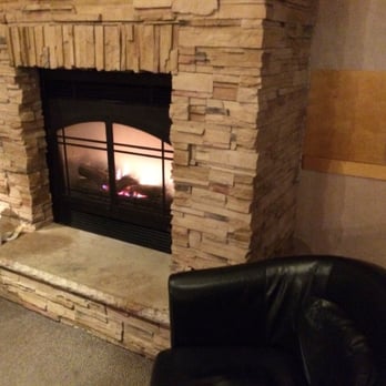 Grounds For Celebration - a fireplace in a living room - Coffee & Tea Near Me - Des Moines, Iowa