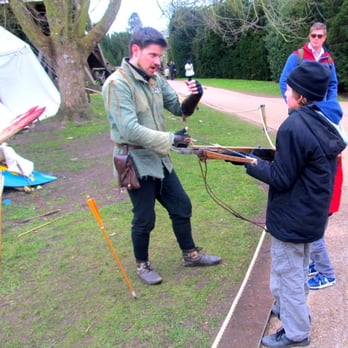 Warwick Castle - Robin Hood like guy teaching my friend's nephew about shooting - Cultural Center Near Me - Warwick, WAR