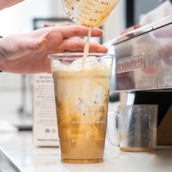 Place your order ahead in our app. Iced latte being perpared.