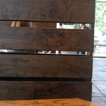Sweet Leaf - Pallets stained with varnish divide the table booths - Salad Near Me - Arlington, Virginia Sweet Leaf - Pallets stained with varnish divide the table booths - Salad Near Me - Arlington, Virginia