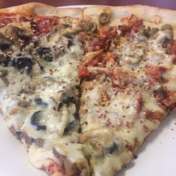 Rosario’s Pizza - Supreme on the left, veggie on the right. So many toppings under that cheese! - Italian Near Me - Concord, North Carolina Rosario’s Pizza - Supreme on the left, veggie on the right. So many toppings under that cheese! - Italian Near Me - Concord, North Carolina