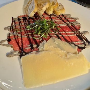Malio's Beach House - Prime tenderloin carpaccio, truffled baby greens, Shaved romano, Portobello aioli, & crostini - Seafood Near Me - St. Pete Beach, Florida Malio's Beach House - Prime tenderloin carpaccio, truffled baby greens, Shaved romano, Portobello aioli, & crostini - Seafood Near Me - St. Pete Beach, Florida