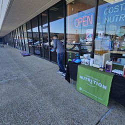 Cost Plus Nutrition - Competing for a gift certificate on Liquid Deaths cornhole boards. Free samples of an awesome multi