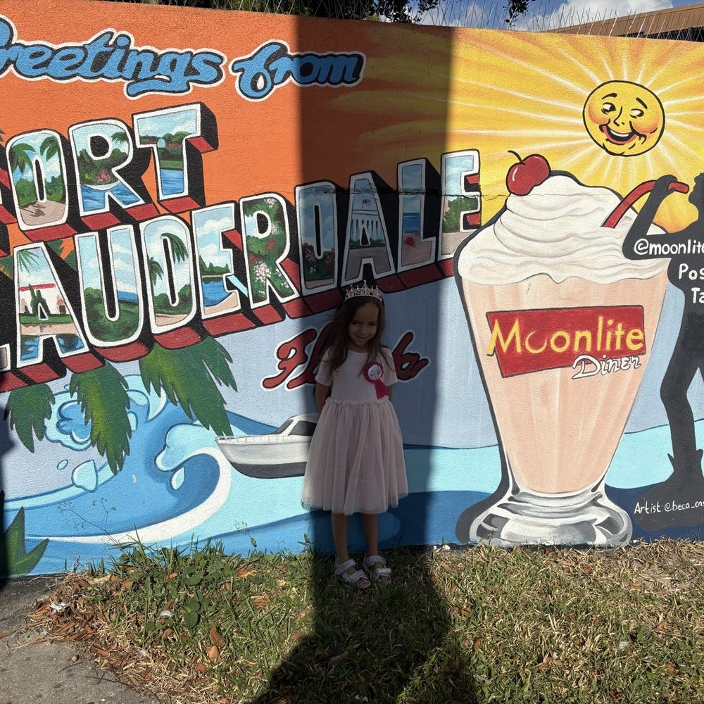 My daughter in front of the diner sign My daughter in front of the diner sign