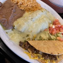 Mexican plate with green chicken enchiladas. Mexican plate with green chicken enchiladas.
